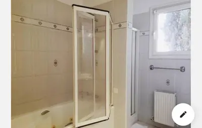 a shower with a glass door in a bathroom at St Elena Boutique Residence in Larnaka