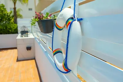 a boat with a rainbow rope on the side of it at Villa Lantos Central Protaras in Protaras