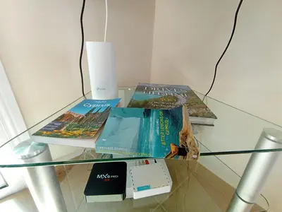 a glass table with some books on top of it at Summer Breeze - Cheerful 2 bedroom villa with pool in Ayia Napa