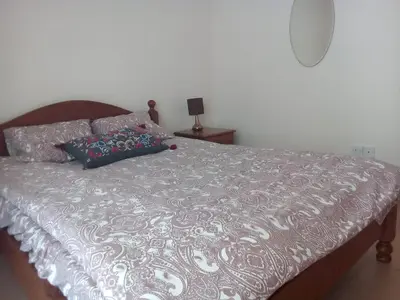 a bed with two pillows on top of it at Summer Breeze - Cheerful 2 bedroom villa with pool in Ayia Napa