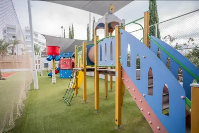 a park with a playground with a slide at MARGADINA HOTEL in Ayia Napa