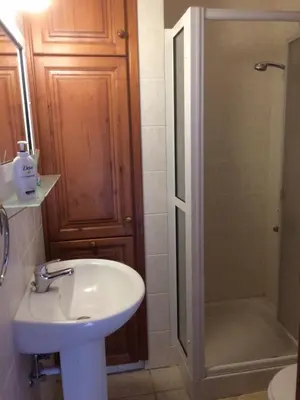 a bathroom with a sink and a shower at AYIOS NICOLAOS RIVER PARK in Perapedhi