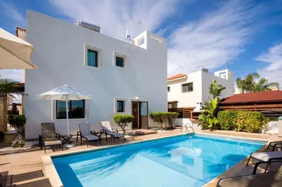 a villa with a swimming pool in front of a house at Villa Abdera - 4bed with Private Pool in Protaras