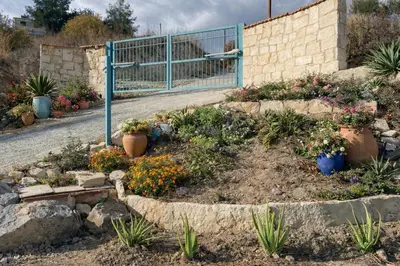 a garden with flowers on the side of a road at House on a Hill with Stunning Views near Troodos in Silikou
