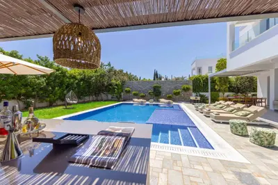 a villa with a swimming pool and a patio at Villa Green Haven 2 Protaras Cyprus in Protaras