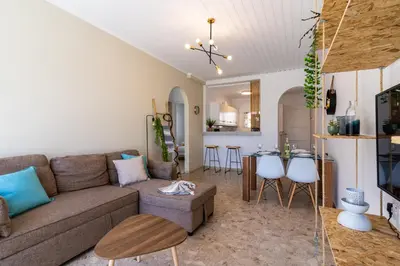 a living room with a couch and a table at Keylana's 2-BR Apt in Pyla in Pyla