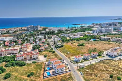 an aerial view of a city with the ocean at Nissi Villa Ourania in Ayia Napa