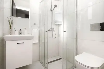 a bathroom with a shower and a toilet and a sink at Villa Queen Valentina in Protaras