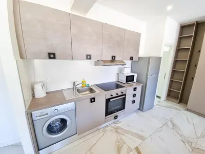 a kitchen with a washing machine and a sink at Happy Homes Paradise in Larnaka