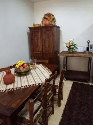 a dining room with a table with fruit on it at Glykoharama Cottage in Kalopanayiotis