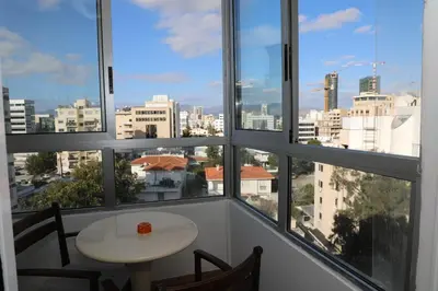 a view of a city from a room with windows at Achillion Apartments By 'Flats Nicosia' in Nicosia