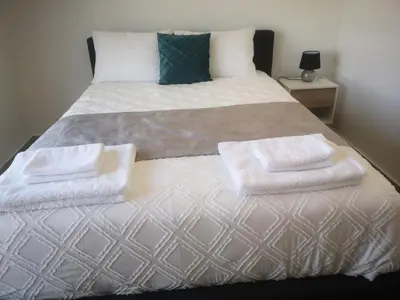 a bed with two towels on top of it at Cielo Apartment No2 in Ayia Napa