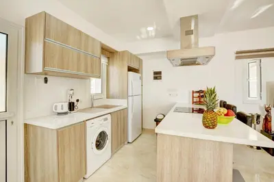 a kitchen with a sink and a dishwasher at Villa Mario - 2min walk from Kapparis Beach in Paralimni