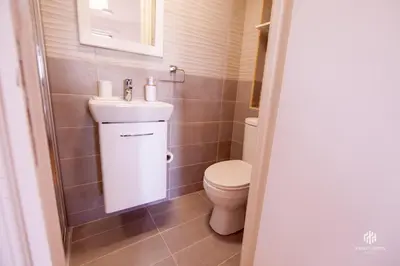 a small bathroom with a toilet and a sink at VINGT-DEUX Vouni 22 in Vouni