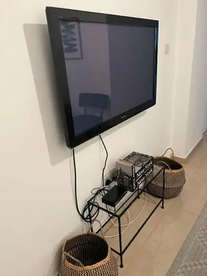 a flat screen tv hanging on a wall at Demetra 1 Bdr Down Town Nicosia in Nicosia