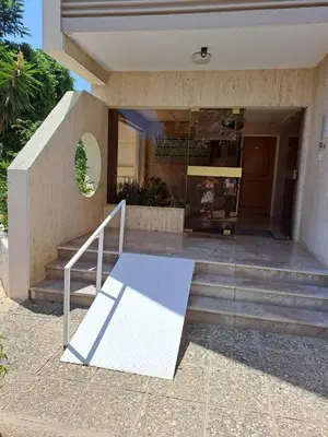 a building with a staircase in front of a building at Seascape 501 in Larnaka