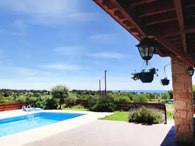 a villa with a pool and a view at Villa Grand Zeus in Anoyira