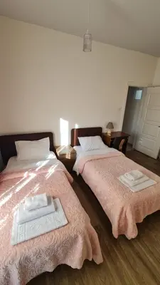 two beds sitting next to each other in a room at Oytam apt in Nicosia