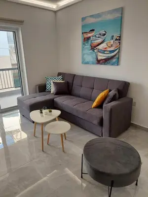 a living room with a couch and a table at Amazing Napa Apartment in Ayia Napa