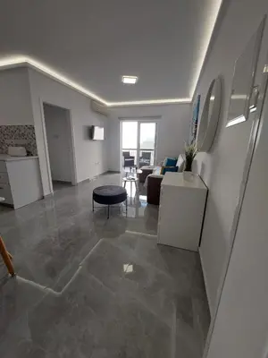 a living room with a couch and a table at Amazing Napa Apartment in Ayia Napa