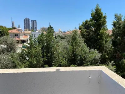 a view from the roof of a house with trees at 1-bedroom apartment with view in Limassol