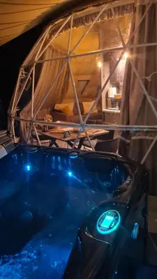 a bath tub with blue lights in a room at Agros Glamping Boutique in Agros