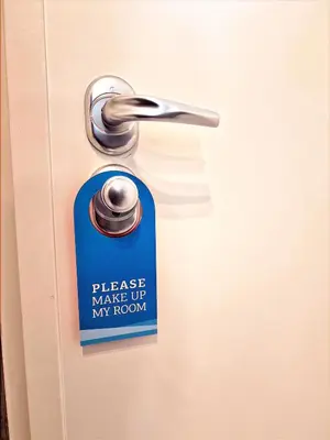 a sign on a door that says please make up my room at Sveltos Residence Suites in Larnaka