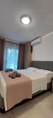 a bedroom with a large bed and a window at Stay With Oleg C17 in Paralimni