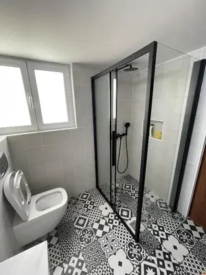 a bathroom with a shower and a toilet at 2 bedroom apt in Ermou 4 minute walk beach in Larnaka