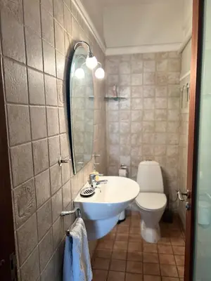 a bathroom with a sink and a toilet at SEA VIEW AMATHUS LUXURY APT in Limassol
