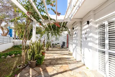 a walkway with a pergola on a house at Blossom Holiday Villa DPS18 in Protaras