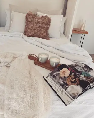 a bed with a book and two candles on it at Fig&Olive Luxury one bedroom boutique in Pachna in Limassol