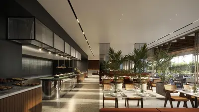 a restaurant with tables and chairs and a cafeteria at The Nines in Ayia Napa