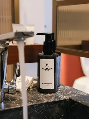 a bottle of balm sitting on a counter at The Nines in Ayia Napa