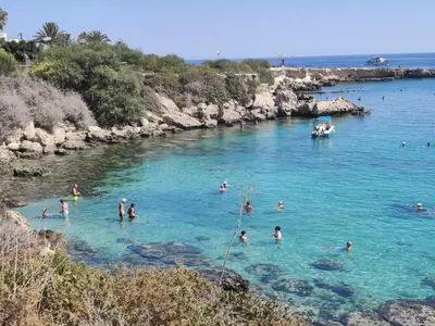 a group of people swimming in a river at Dream Vacation by the Sea Protaras in Protaras