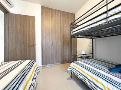 a bedroom with two bunk beds in it at Albert's apartment St. Lazarus 401 in Larnaka