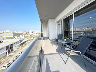 an apartment balcony with a view of the city at Albert's apartment St. Lazarus 401 in Larnaka