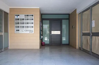 an empty hallway of a building with a sign on the wall at 2-bedroom appartment in center in Nicosia
