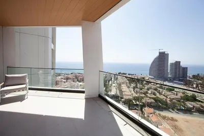 an apartment balcony with a view of the city at Sky Tower in Limassol