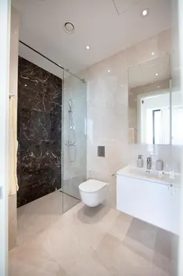 a bathroom with a toilet and a sink and a shower at Sky Tower in Limassol