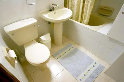 a bathroom with a toilet and a sink at Maria Villa in Pissouri