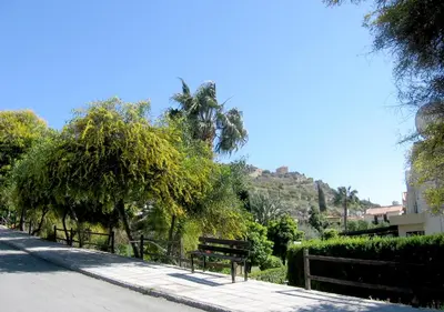 a park bench on the side of a street at Maria Villa in Pissouri