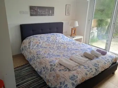 a bedroom with a bed with towels on it at Nicosia rest and relax 1 bedroom apartment in Nicosia