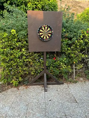 a dart board sitting on top of a stand at Bay Cottage Beautiful cosy luxury cottage - Beach area in Pissouri