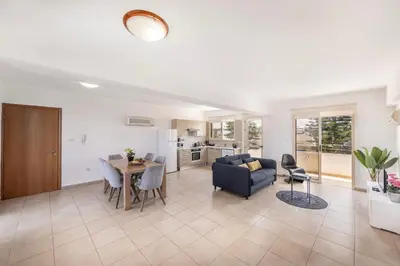 a living room with a couch and a table at Pelagos apartment 6 in Paralimni