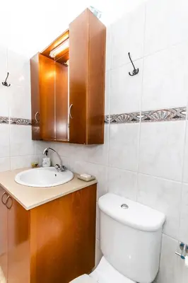 a bathroom with a toilet and a sink at Reel Paradise Villa, Cyprus in Larnaka