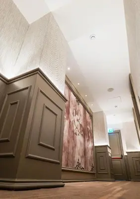 a hallway with a painting on the wall in a building at Gate Twenty Two Boutique Hotel in Nicosia
