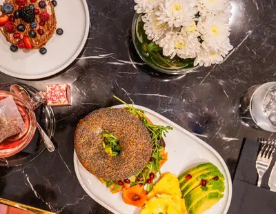 a table with plates of food on a table at Gate Twenty Two Boutique Hotel in Nicosia