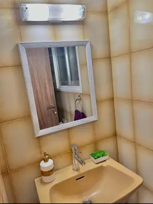a bathroom with a sink and a mirror at Urban Retreat - Your Ideal Getaway in Limassol in Limassol