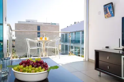 a bowl of fruit on a table in a kitchen at SHARON - Coralli Beachfront Apartment in Protaras